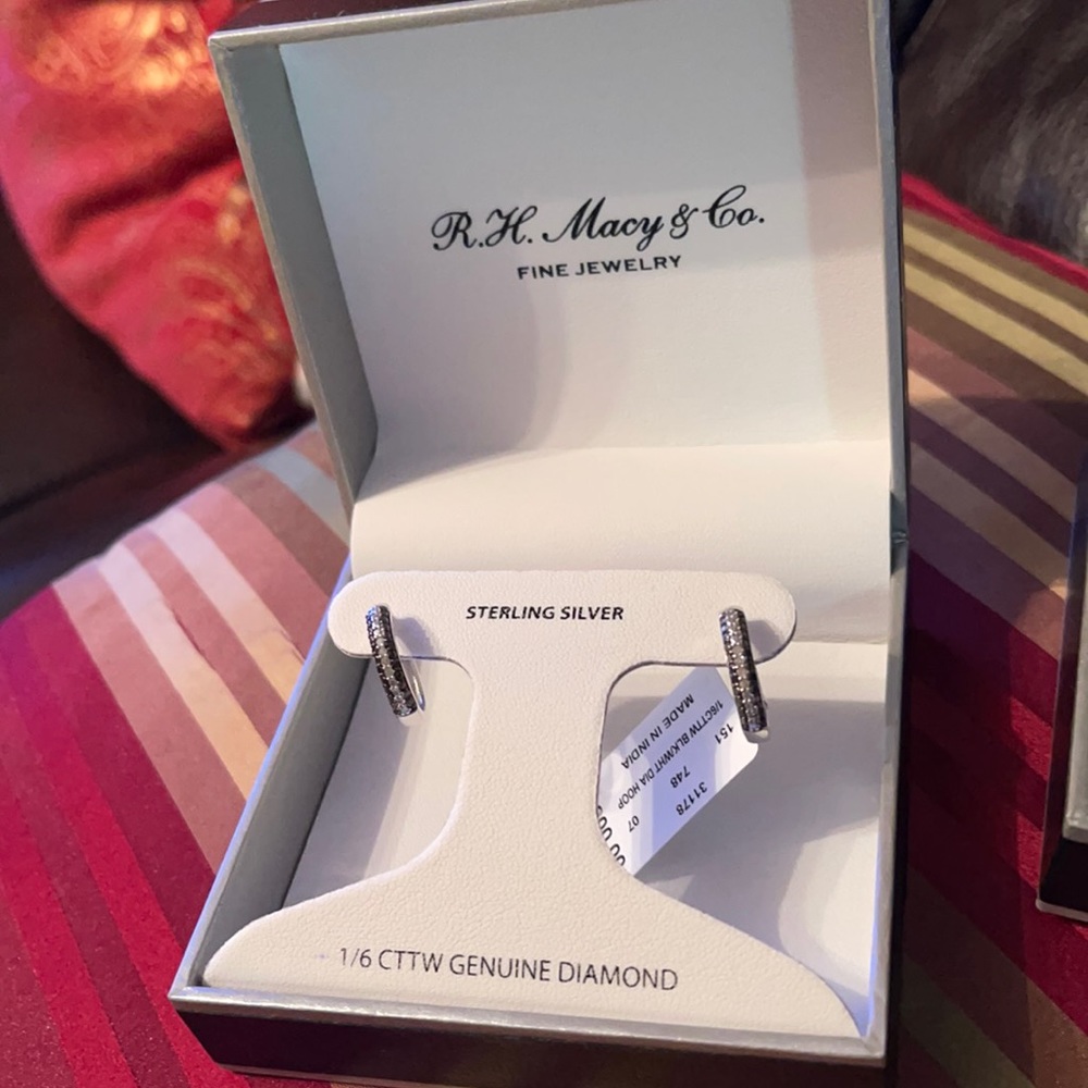 Macy’s earring with tag and box.